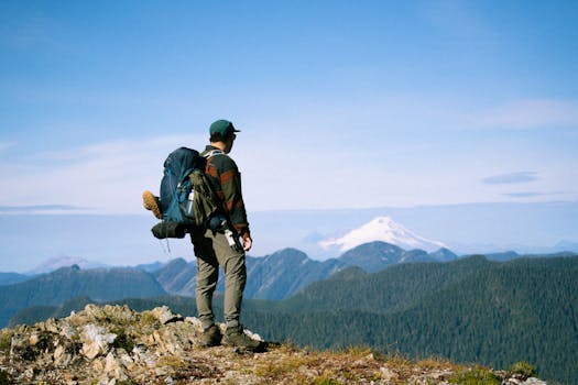 Hiker enjoying a breathtaking view of Mt. Baker in Washington, perfect for travel and adventure themes.