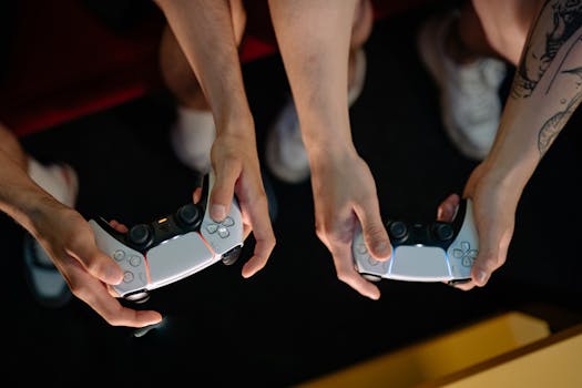 Two gamers playing with wireless controllers during a gaming session indoors.